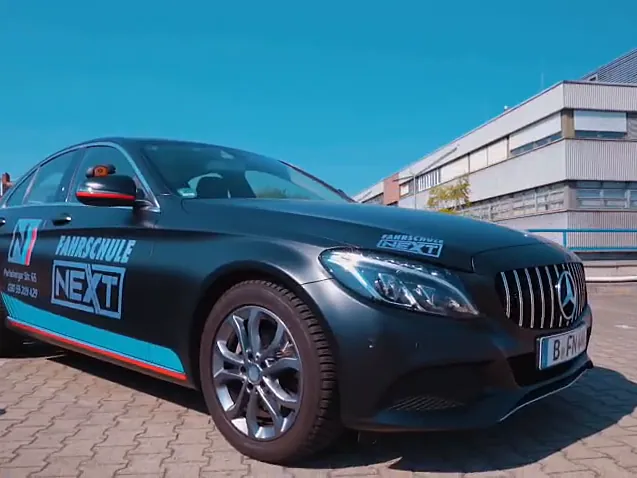 Black Mercedes C-Class in Next livery, front view